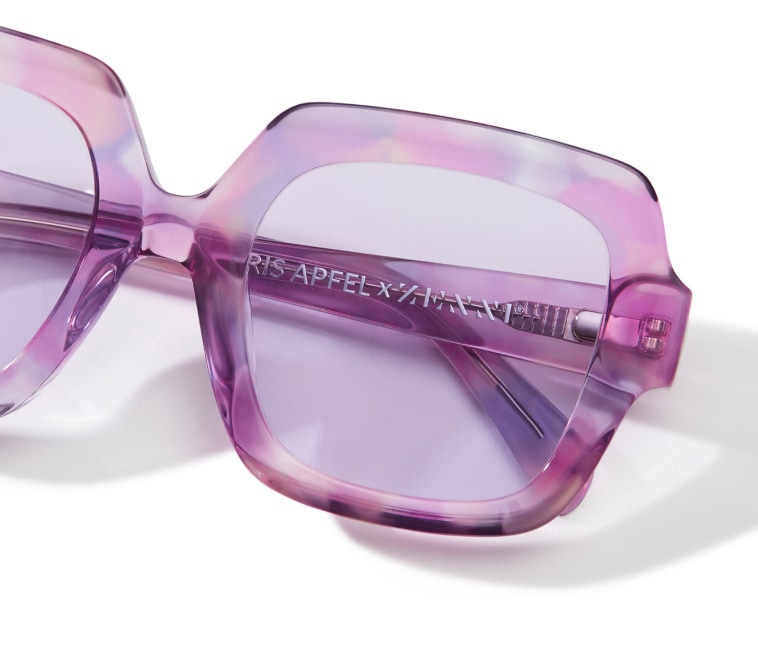 Purple and pink patterned transparent square frames with pink lenses.