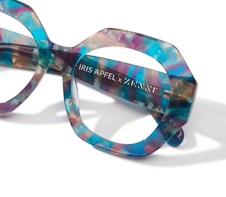 Transparent geometric frames with a shimmering purple, blue, gold, and white tortoiseshell-like pattern.