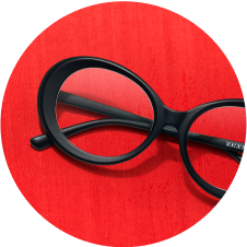 Image of Zenni oval glasses #2023021 against a red background.