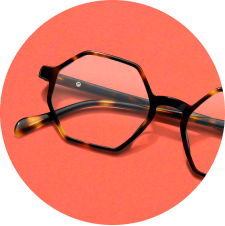 Image of Zenni geometric glasses #4442225 against a coral background.