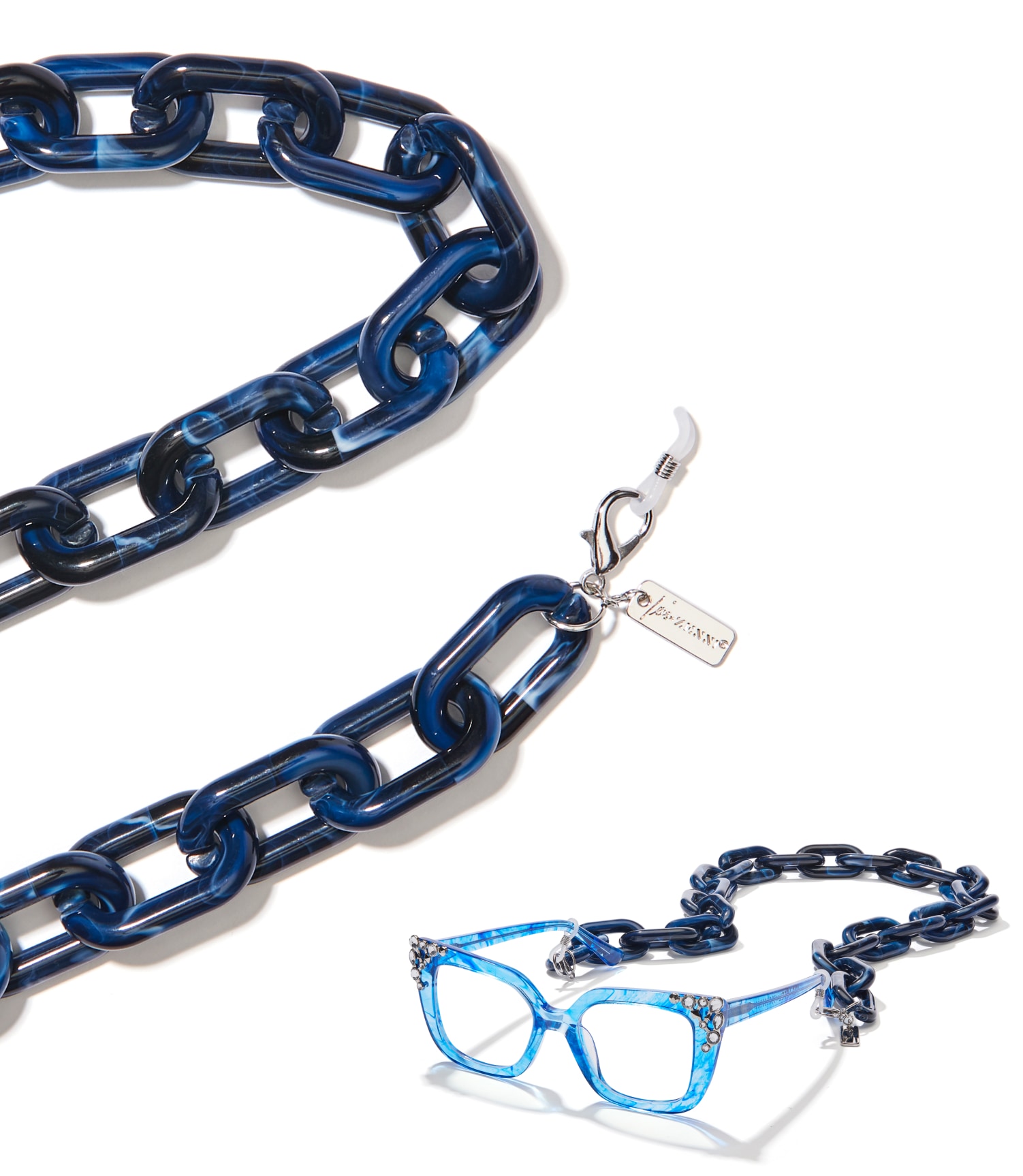 Image of a close-up shot of the Iris Apfel x Zenni Unbroken chain, with clasp closures, logo charm, and chunky links. Below the image is a pair of Iris Apfel x Zenni glasses with the unbroken chain attached. 
