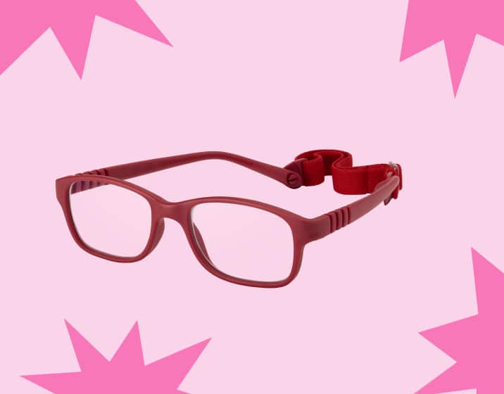 Rectangle red kids’ glasses with flexible temple arms and a head strap, on a beige background with pink starburst shapes.