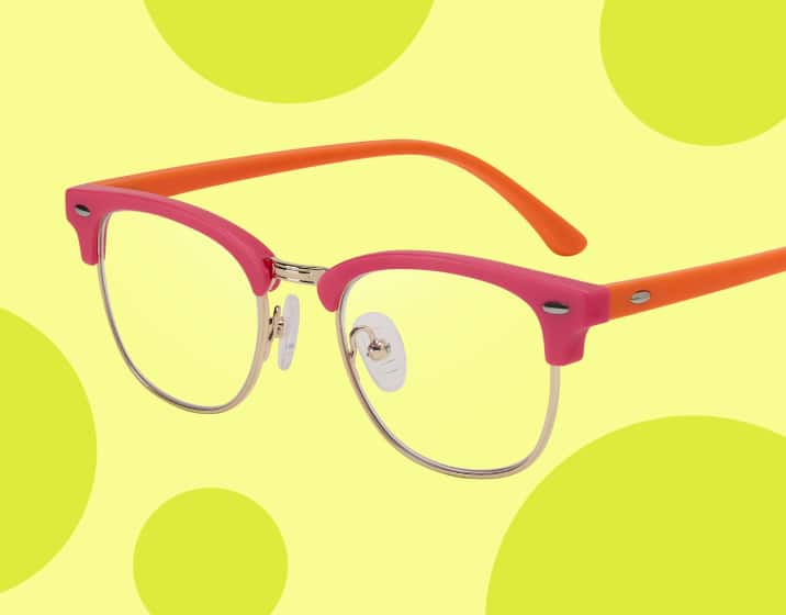 Red browline kids’ glasses on a beige background with green circles.