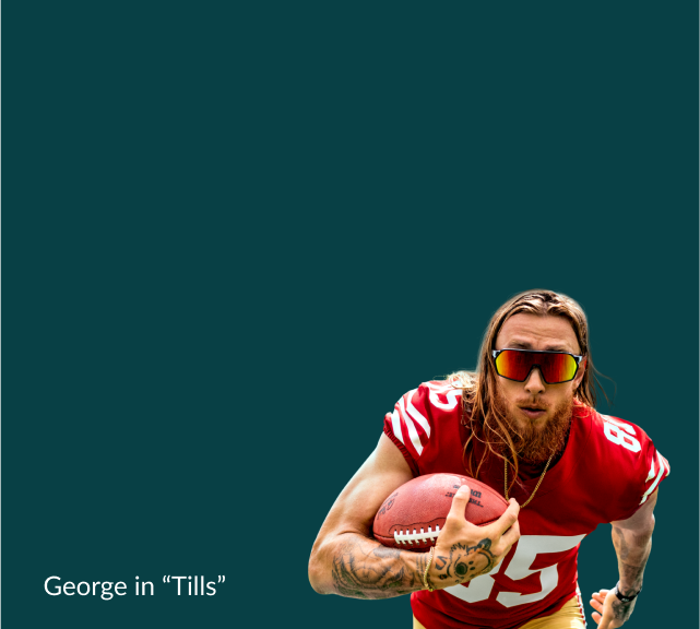 George Kittle with his long blonde hair worn down is intensely looking ahead wearing black “Tills” wraparound sport performance sunglasses with reflective lenses and his red San Francisco 49ers jersey, gripping a football in action against a dark teal geometric pattern background. Brought to you by the Kittles x Zenni collection