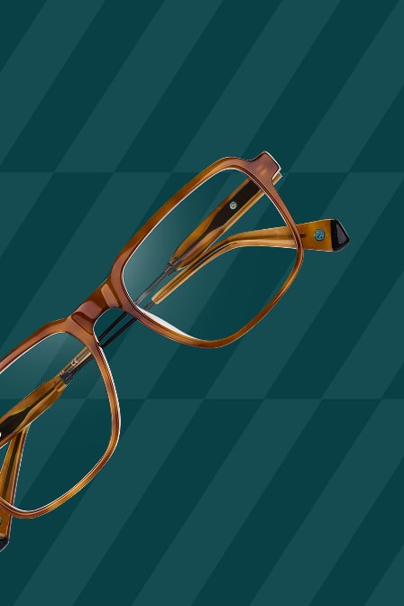 Close-up of brown square-shaped Zenni glasses on a dark teal patterned background.