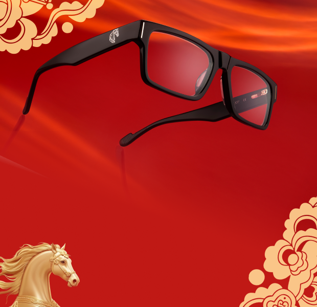 Black thick-rim rectangle Zenni glasses with a gold horse design on the temple arm, surrounded by a gold floral horse motif over a red background.