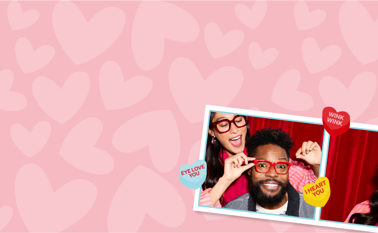 A Valentine's Day-themed image with a pink background covered in light pink hearts. Two framed photos show cheerful people wearing brightly colored glasses. One photo features a woman in red glasses playfully placing them on a man wearing matching red frames. The other photo shows a woman excitedly wearing heart-shaped pink sunglasses.