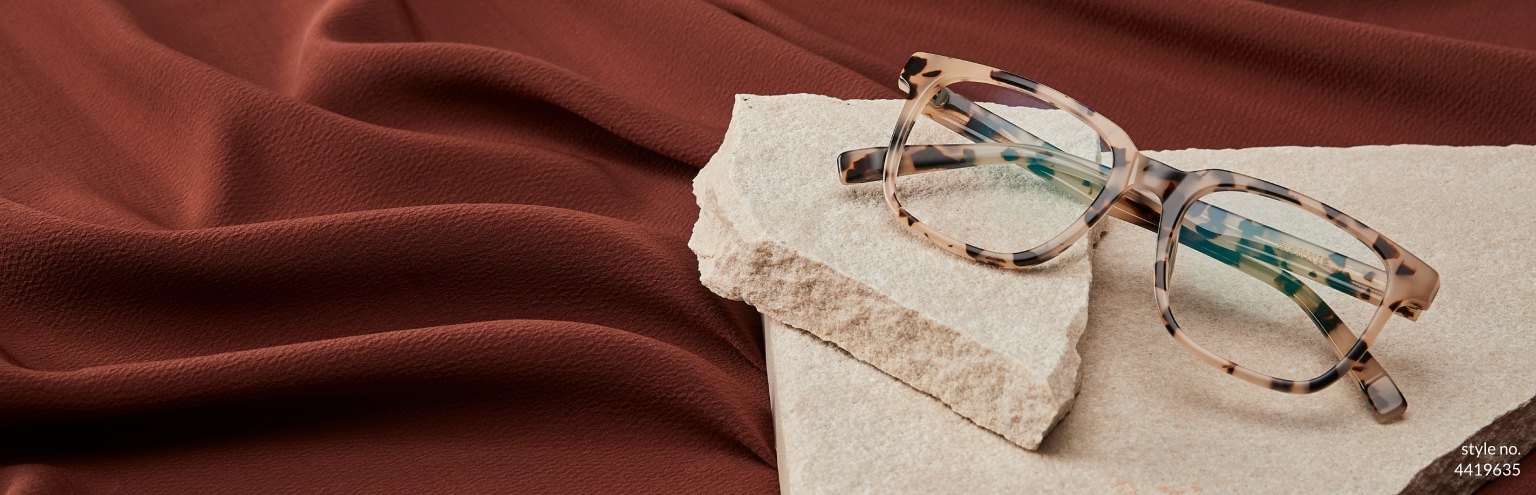 Men’s new arrivals. Set your sights on this season’s hottest new eyewear. Image of Zenni square glasses #4419635 set atop a pile of sheet rock, in front of a warm brown background.