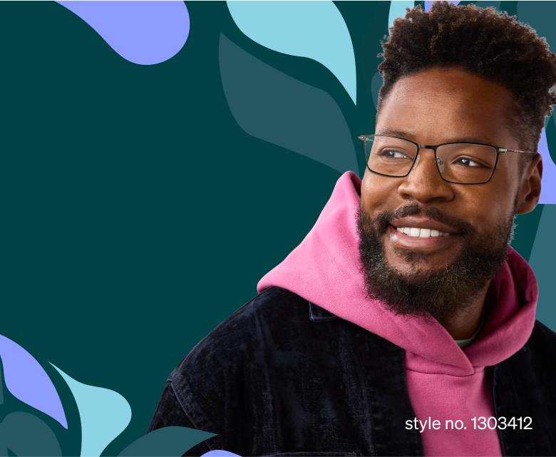 A bearded man wearing rectangle black glasses style no. 1303412, a pink hoodie, and a dark jacket smiles while looking to the right. The vibrant background features abstract leaf shapes in shades of blue, green, and purple.