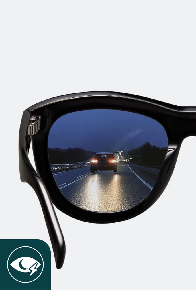 Comparison of road view through two lenses, highlighting the difference with and without night driving lenses, showing enhanced clarity and improved hazard detection through the Zenni Night Driving lens.