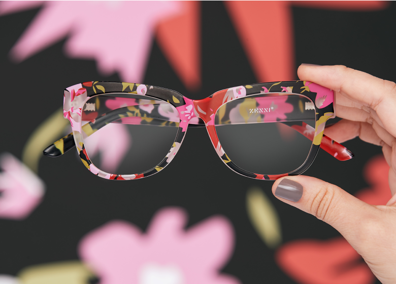 Women wearing Zenni floral patterned oversize square glasses 2026729, posing against a floral background.