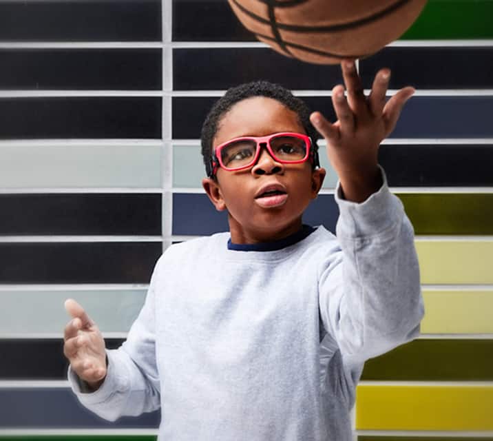 Non-slip, comfort bridge and temples icon. Image of a kid playing basketball, wearing Zenni kids’ sport protective goggles #743318.