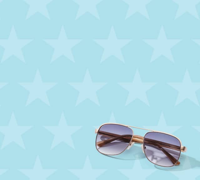 Gold aviator with gradient tints on a light blue background with white star pattern.