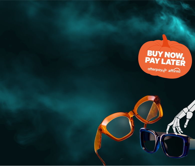 Orange and blue glasses against a misty, dark background with a skeleton hand, reinforcing the spooky atmosphere.