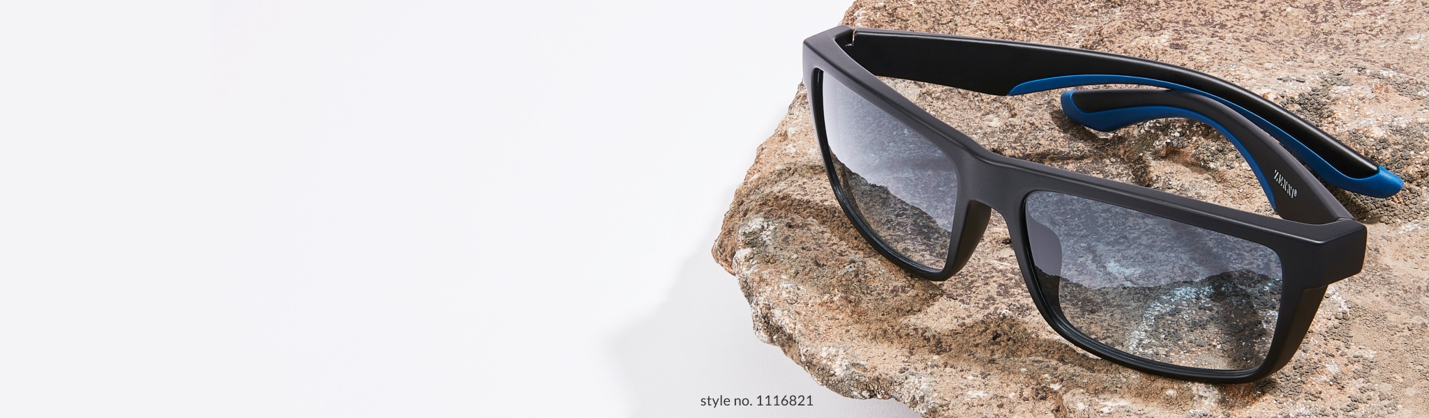 Image of Zenni premium rectangle sunglasses #1116821 placed on a sheet of rock, against a white background.