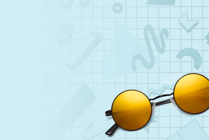 Black metal round glasses with yellow mirror lenses on a light blue background with a nineties squiggle and grid motif.