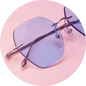 Image of Zenni rimless style #138614, shown with a lavender tint and a pink background.