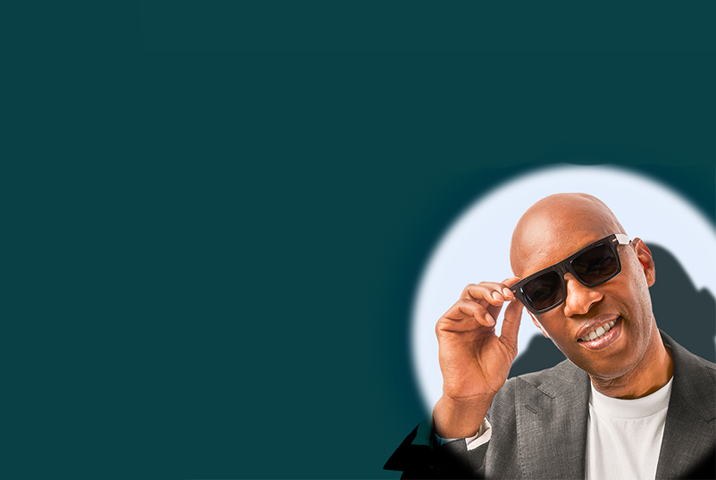 Sam Cassell in Zenni sunglasses, exuding confidence and a smile against a white background.