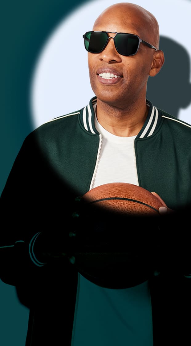 Sam Cassell holding a basketball and wearing Zenni dark aviator sunglasses, spotlighted against teal background.