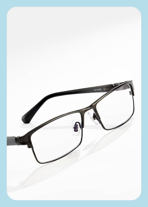 Semi-rimless optical frames from the Sam Cassell Collection by Zenni, on a white surface.