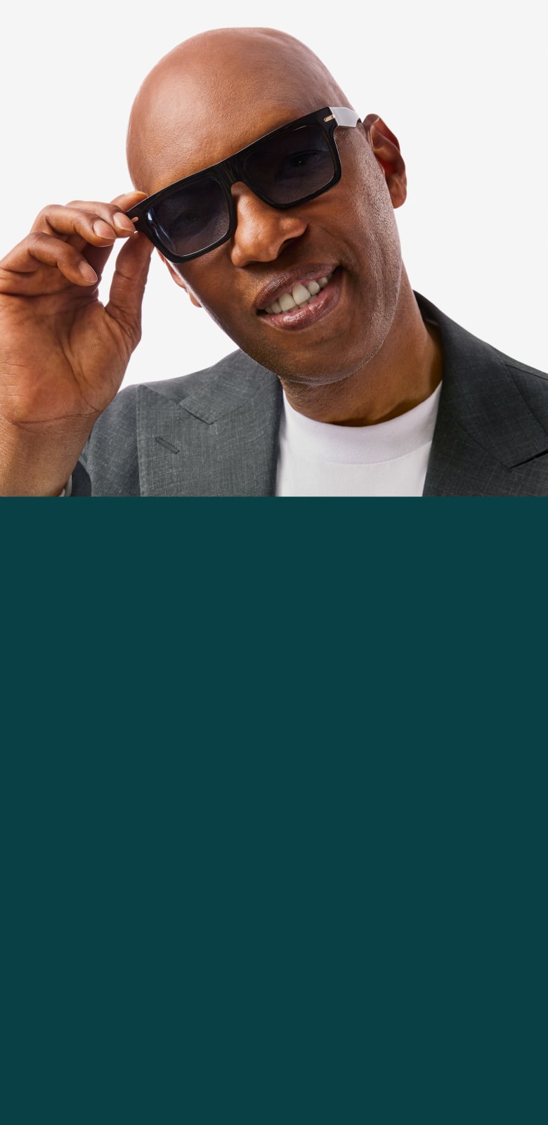 Sam Cassell in Zenni sunglasses, exuding confidence and a smile against a white background.