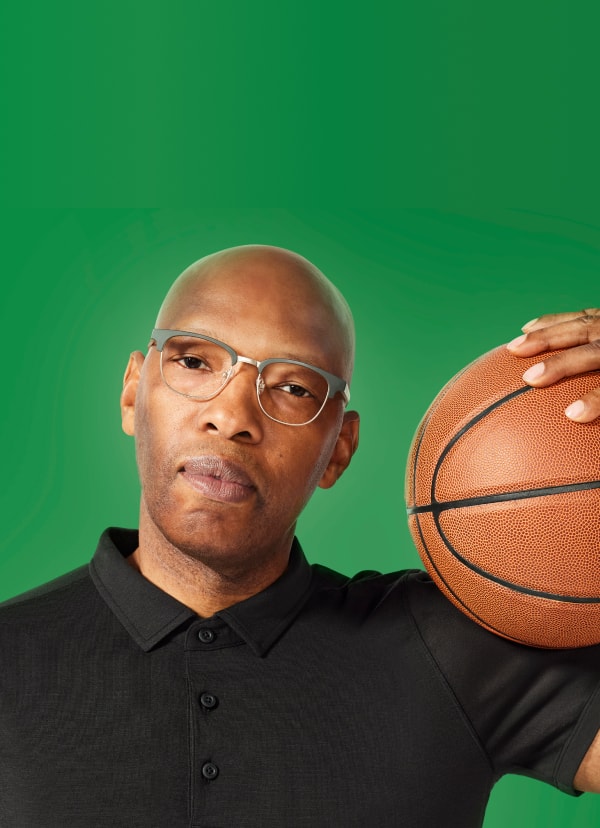Sam Cassell with a basketball, 'See Clearly, Play Strong' wearing Zenni eyewear. ‘View product’ prompt.