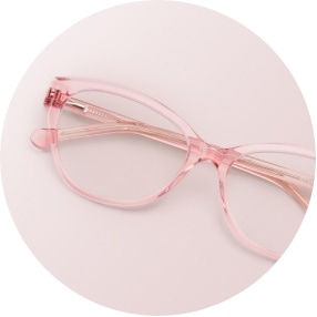 Image of a pair of pink square glasses against a light pink background.