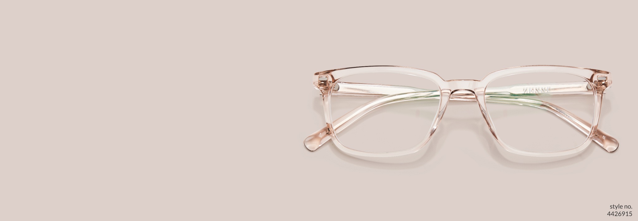 Image of Zenni light brown rectangle glasses #4426915 on a pink beige background.