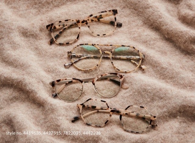 Image of 3 Zenni tortoiseshell glasses laying on a tan blanket.