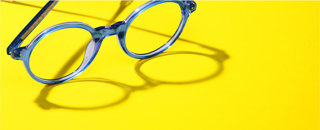 Image of Zenni glasses #4442016 against a bright yellow background, casting a shadow.
