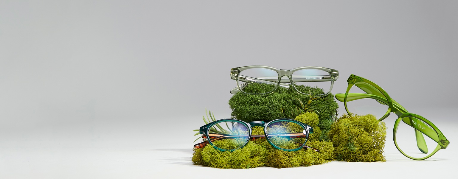 Image of three pairs of Zenni glasses against a beige-colored background.