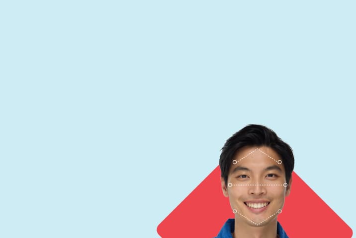 Smiling man with dashed lines tracing a diamond face shape, set against a red diamond background.