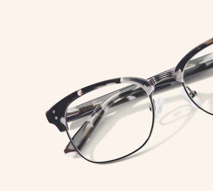 Image of Zenni black-patterned browline glasses style #199431 shown with a beige background.