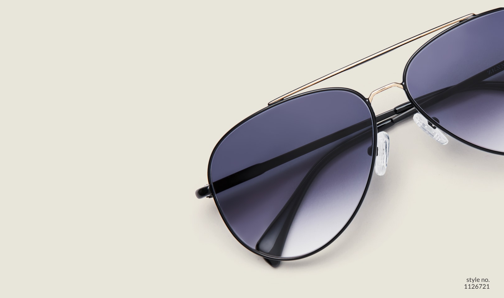 Image of Zenni black aviator style #1126721, shown with a gray gradient tint and 
                a light green background.