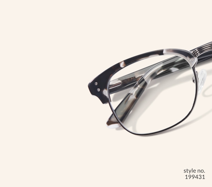 Image of Zenni black-patterned browline glasses style #199431 shown with a beige background.