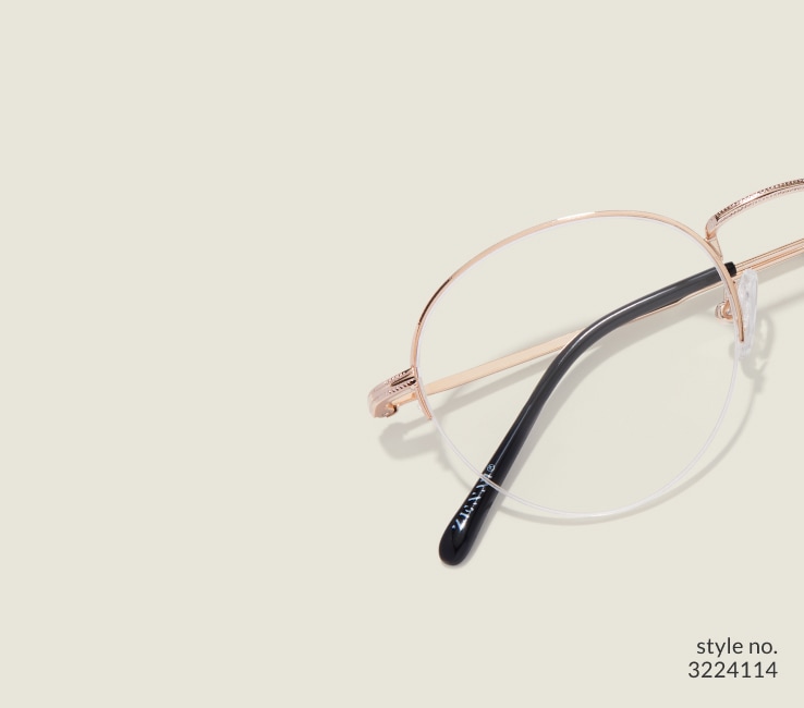 Image of Zenni gold browline glasses style #3224114 shown with a light green background.