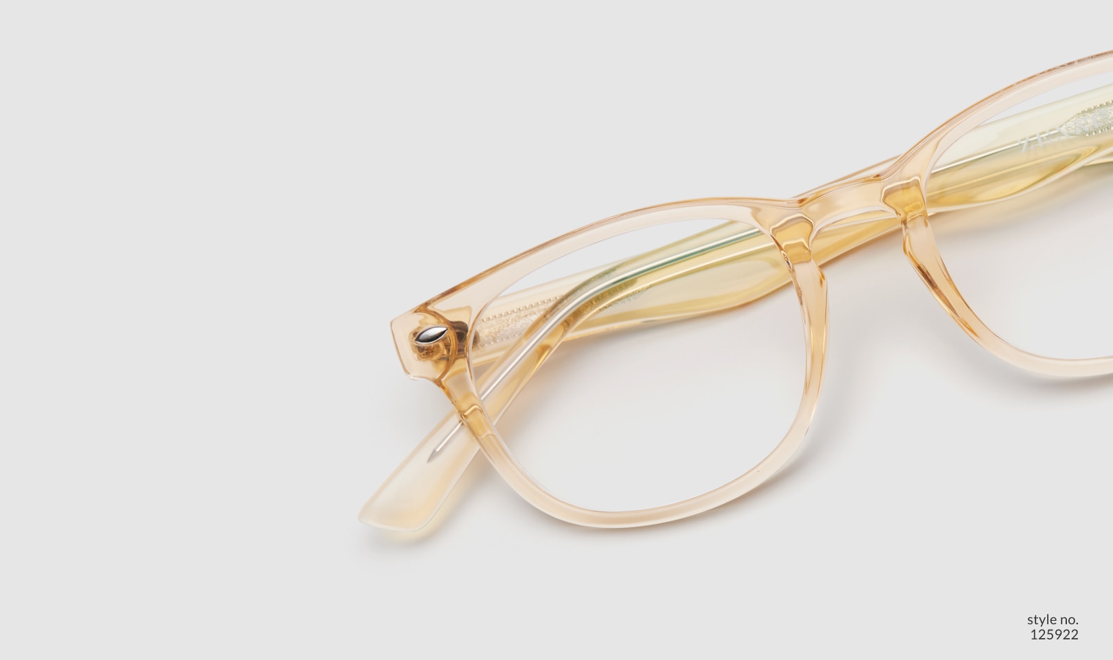 Image of Zenni yellow translucent oval glasses style #125922 shown with a light gray background.