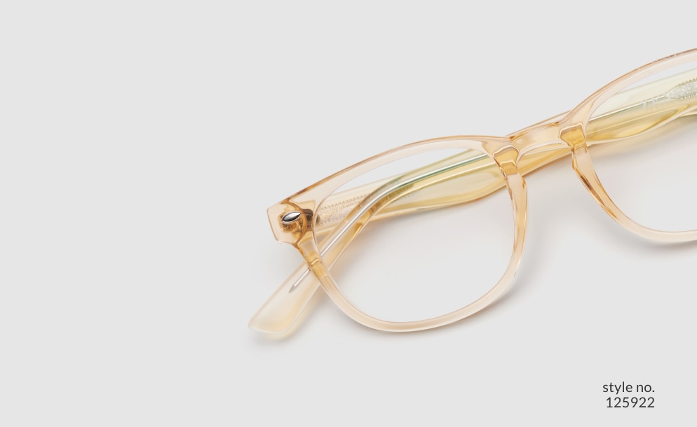 Image of Zenni yellow translucent oval glasses style #125922 shown with a light gray background.