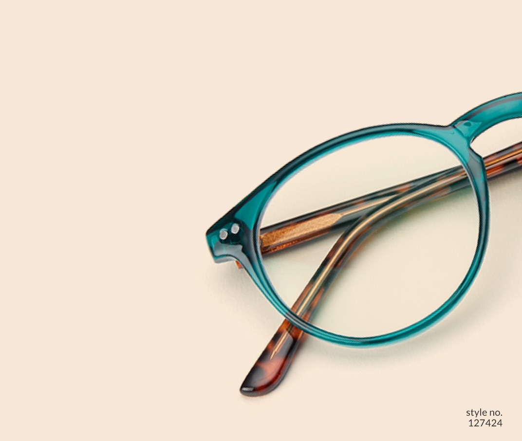 Image of Zenni green round glasses style #127424 shown with a light peach background.