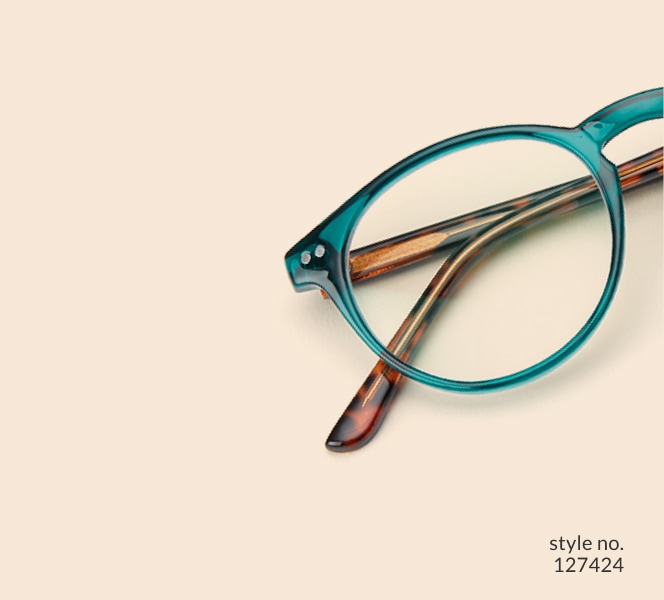 Image of Zenni green round glasses style #127424 shown with a light peach background.