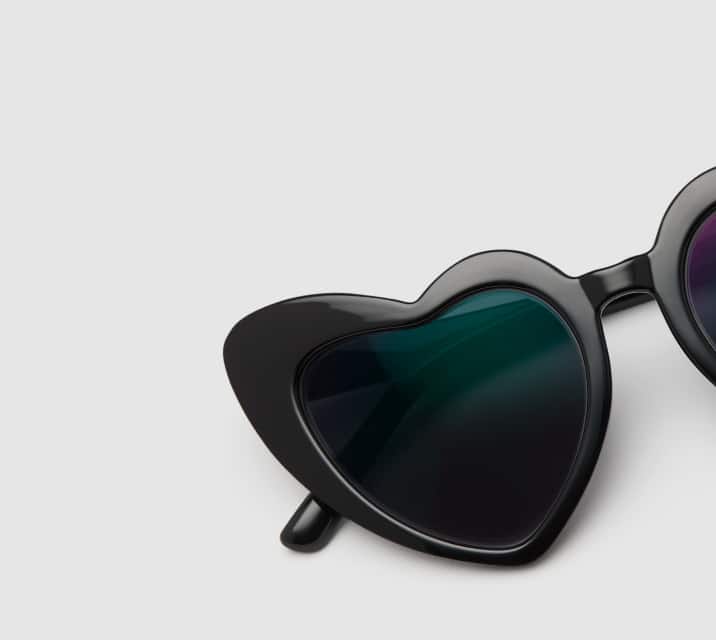 Image of Zenni heart-shaped frame #2029921, shown with a dark gray tint and a light gray background.