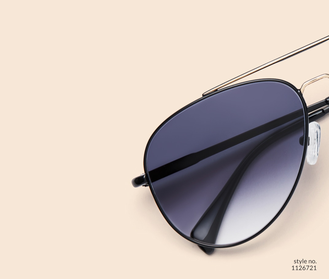 Image of Zenni black aviator style #1126721, shown with a gray gradient tint and a beige background.