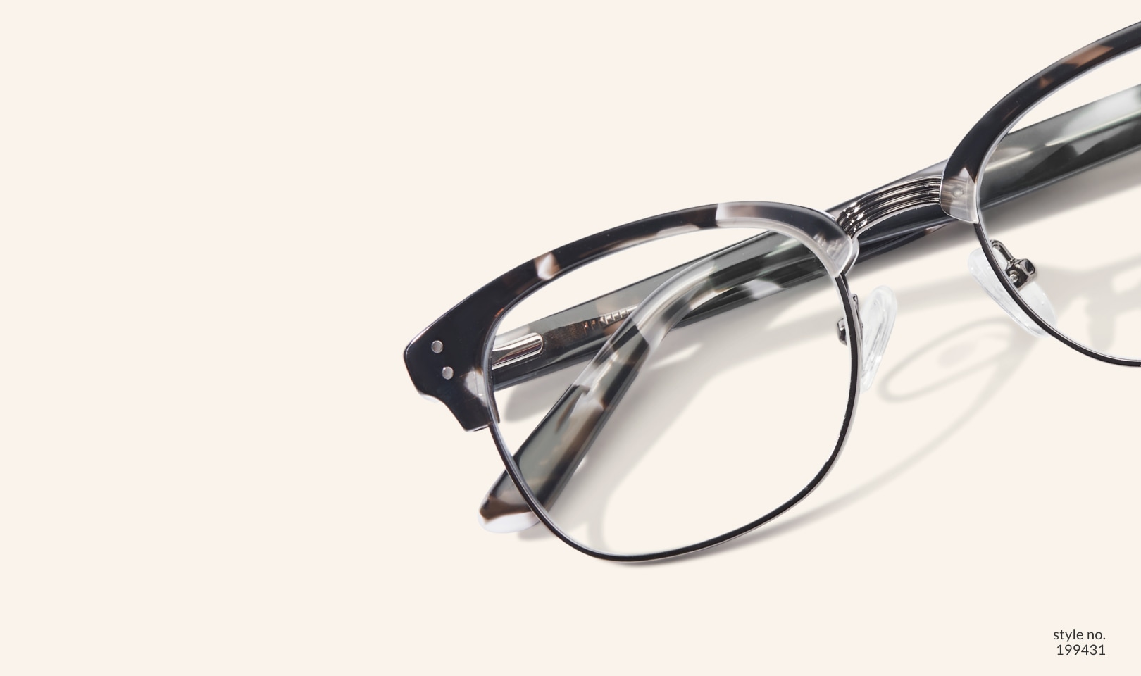 Image of Zenni black-patterned browline glasses style #199431 shown with a beige background.