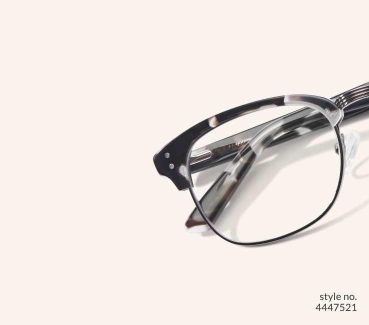 Image of Zenni black-patterned browline glasses style #199431 shown with a beige background.