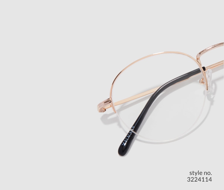 Image of Zenni gold browline glasses style #3224114 shown with a light gray background.
