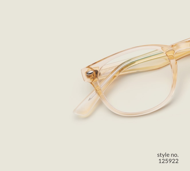 Image of Zenni yellow translucent oval glasses style #125922 shown with a light green background.