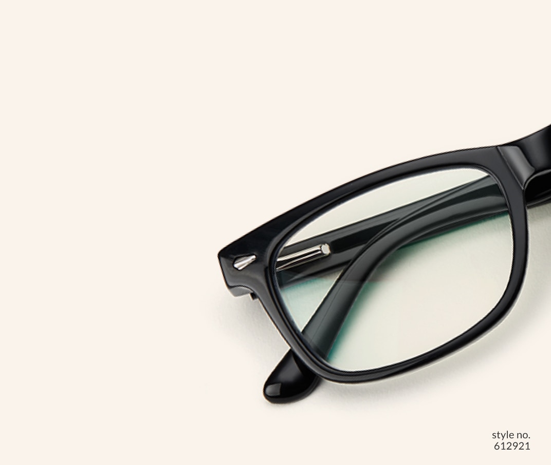 Image of Zenni black rectangle glasses style #612921 shown with a beige background. 