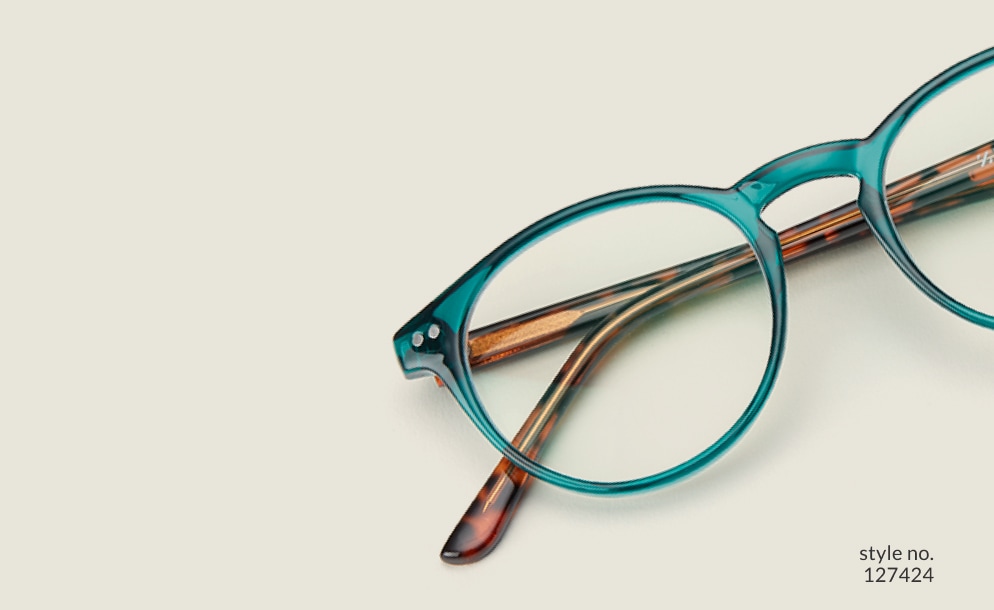 Image of Zenni green round glasses style #127424 shown with a light green background.