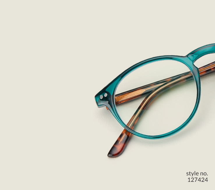 Image of Zenni green round glasses style #127424 shown with a light green background.