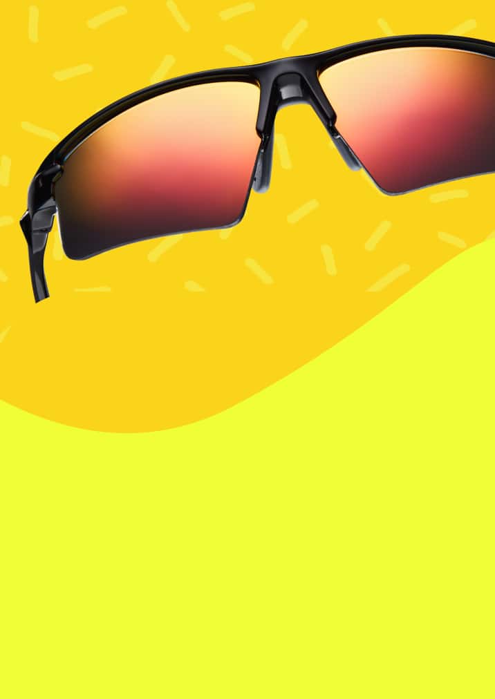 Close-up of Zunnies bounce and slip free running sunglasses with a yellow background.